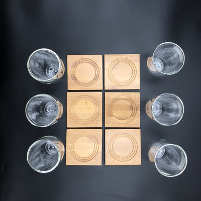 A Set Of 6 Bamboo Coaters/ Trays With 6 Doublewalled Thermo Glasses To Match